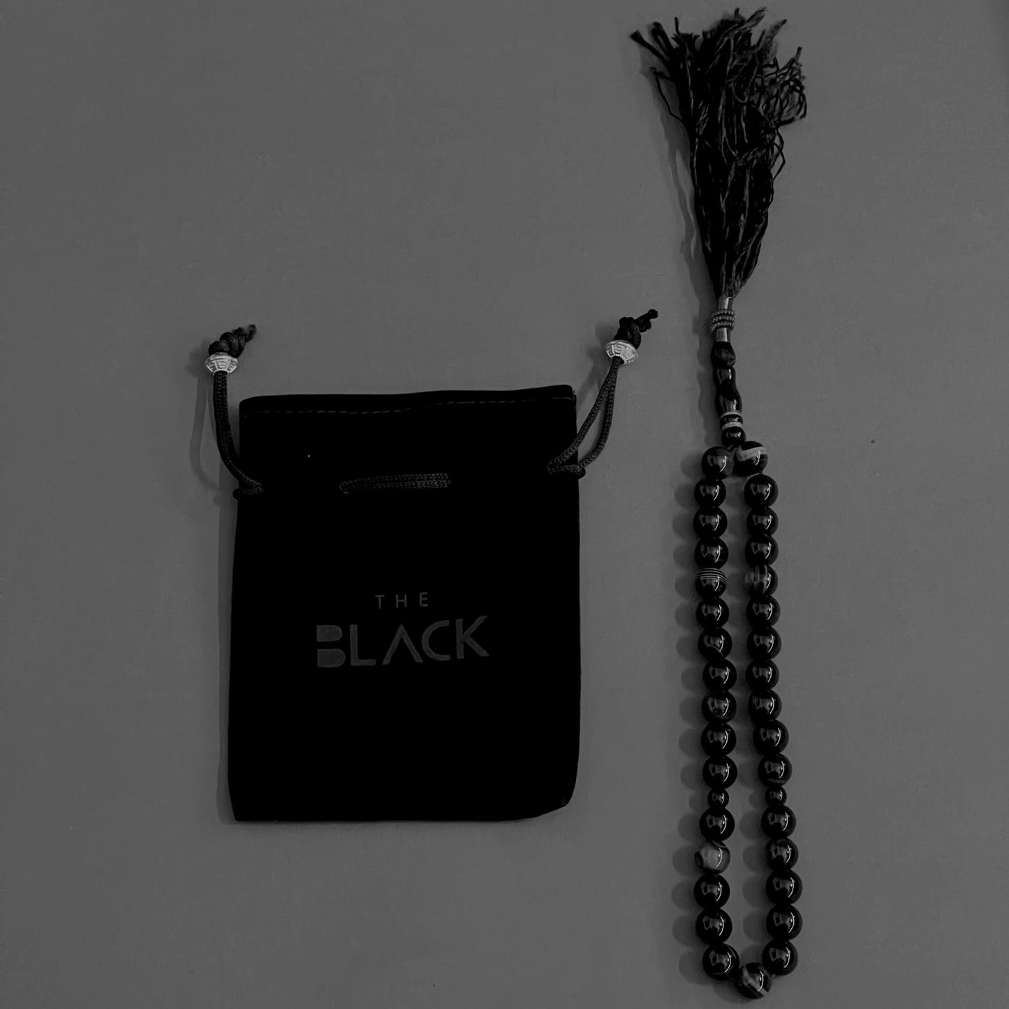 The Black Tasbih Aqeeq with Black Pouch